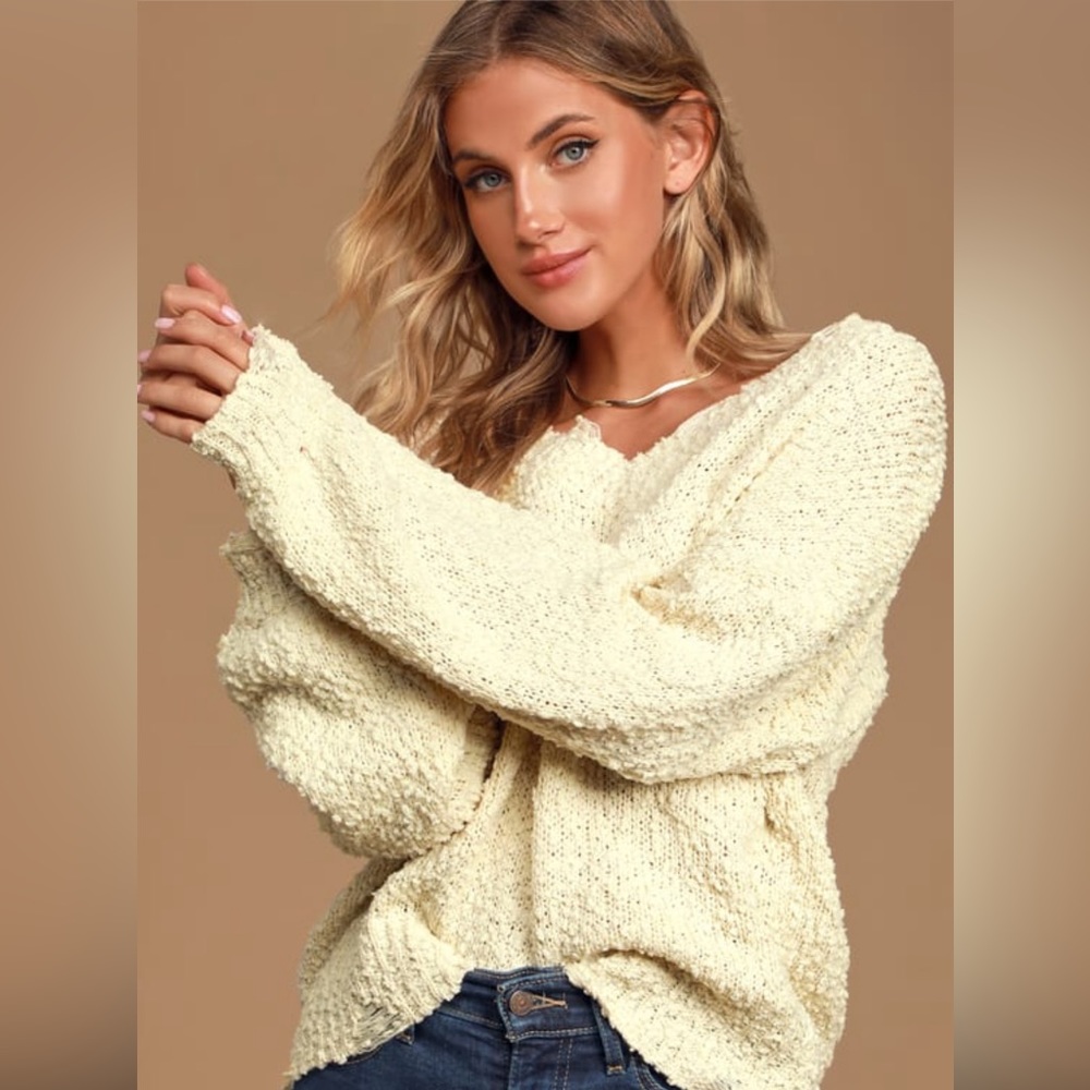 Oversized V-Neck Sweater with Distressed Details